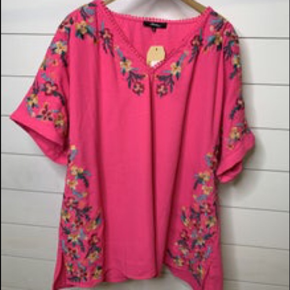 Hot pink embroidered blouse.